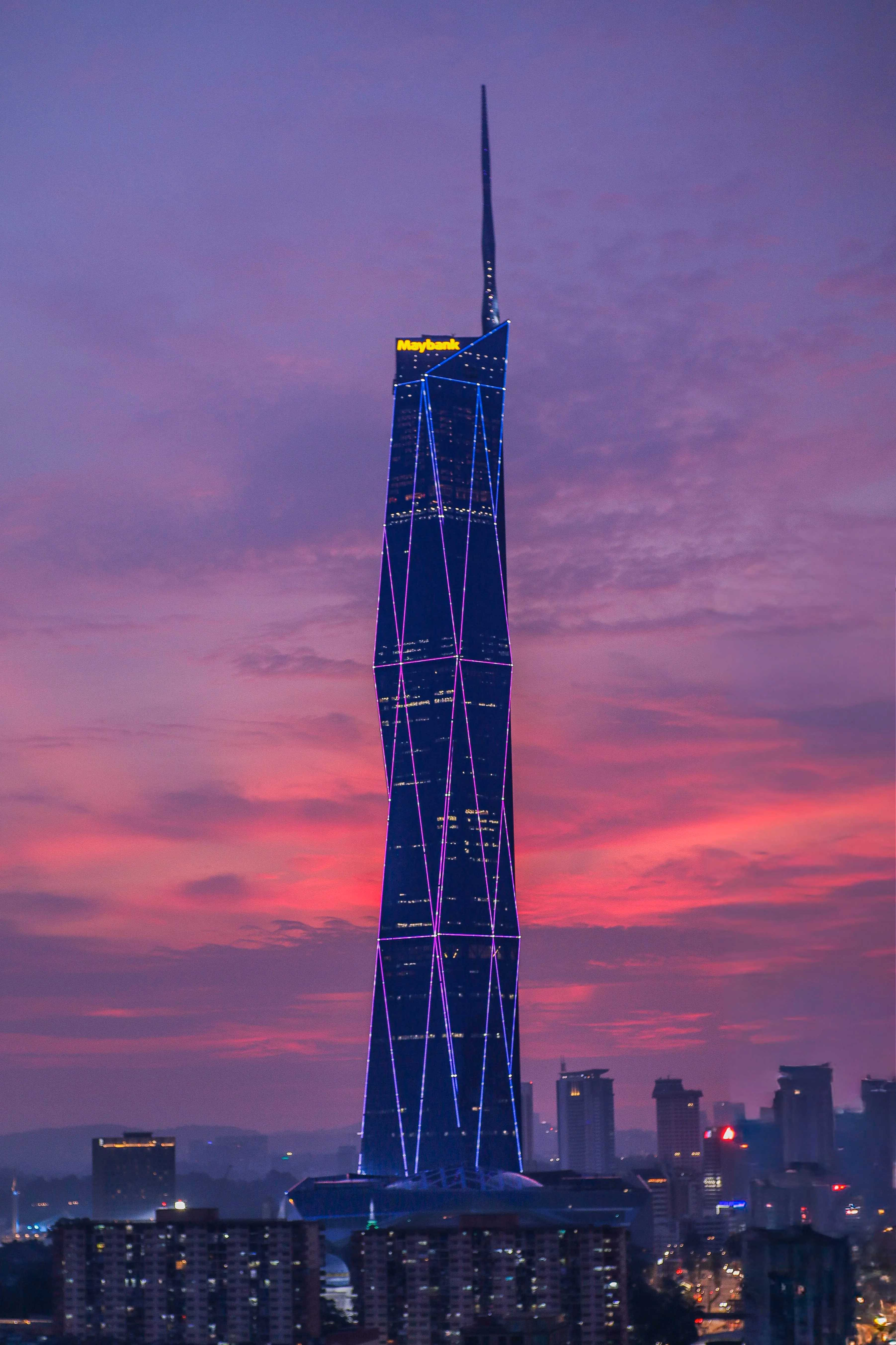 Merdeka 118 beneath a dramatic pink evening sky